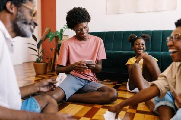 Family sitting down playing a game